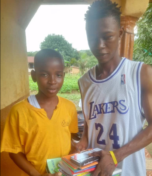 Gideon with volunteer Alusine